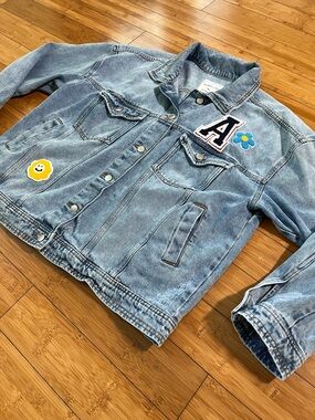 Celebrity Pink Distressed Varsity Denim Jacket with Dopamine Daisy Patches